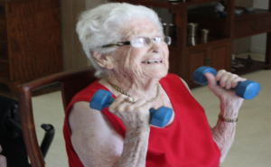 senior citizen doing hand weights