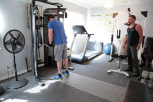 man using weight machine