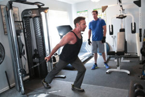 man using weight machine